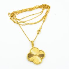 Luck will always be on your side with our Vintage Clover Pendant Necklace in Gold. Show off your unique style with this one-of-a-kind piece that adds a touch of elegance and charm to any outfit. A perfect gift for someone special (or yourself!), this necklace is sure to bring good fortune wherever you go. Who needs a four-leaf clover when you have this stunning pendant around your neck? Go ahead, make a statement and embrace your inner fashionista! ADDITIONAL INFORMATION Color: Gold Stone: no Re Luxury Gold Plated Large Pendant Jewelry, Luxury Gold Jewelry With Large Pendant, Luxury Large Pendant Necklace For Anniversary, Elegant Gold Flower Pendant Jewelry, Formal Yellow Gold Flower Pendant Necklace, Luxury Gold-tone Pendant Necklace, Luxury 22k Gold Tarnish Resistant Jewelry, Luxury 22k Gold Tarnish-resistant Jewelry, Classic Gold Necklaces With Large Pendant