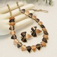 "Unsigned treasure! Vintage chocolate heart thermoset necklace and clip on earrings set with light gold settings. A pretty set with light and dark brown thermoset pieces. The set is in excellent vintage condition. Size - Necklace - 16\"L  X  1/2\" W, earrings - 7/8\".  <3 All of our items are pre-loved, vintage, and antique. Please review pictures carefully. Pictures are enlarged and colors and sizes might not be exact. Please understand that all items are purchased as is and, unfortunately we can't be responsible for buyer's remorse. We may however make a mistake and we welcome corrections with a refund. Please feel free to contact us at any time with any questions or concerns you may have. We want you to enjoy your shopping experience with us! Thank you! Jody and Wendy" Cake Pop Receita, Vintage Chocolate, Brown Chocolate, Chocolate Hearts, Plastic Jewelry, Cake Pop, Jewellery Sets, Vintage Yellow, Vintage Brown