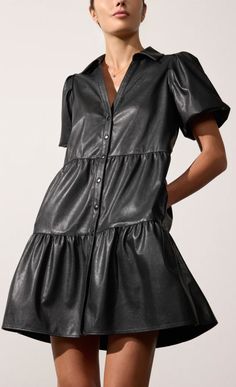 HAVANA MINI DRESS IN VEGAN LEATHER | TPU4033 Runs true to size Relaxed fit Mini length, 36" on size Small Chest Measurements: XS: 36” / S: 37 ½” / M: 39 ½” / L: 42 ½” Tiered skirt V-neckline Button front placket Puff sleeves On seam pockets Stretch Vegan Leather 87% Polyurethane/13% Spandex Imported Model is 5'9" and is wearing a size Small This vegan leather tiered skirt is a stunning piece that beautifully blends femininity with practicality. The puff sleeves add a romantic touch, while the co Leather Mini Dress, Tier Skirt, Small Chest, Big Sister, Tiered Skirt, Leather Mini, Mini Black Dress, Cashmere Sweaters, Sweater Jacket