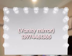 a sign that says vanity mirror with lights around it