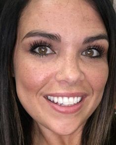 a close up of a woman with brown eyes