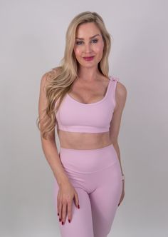 The Clara Bra is for those wanting an extra touch of femininity to their basic sports bra. Designed for comfort and cuteness whether you are running errands or enjoying your workout. This bra offers medium support, with a scoop neckline to flatter your figure. The best part is the dainty bows that adorn your shoulders for that little bit of extra. Details Removable Cup Inserts Adorable Shoulder Bows Scoop Cut Front & Back Elastic Ruffle Under Bust Band Non Adjustable Straps 4-Way Stretch Antimic Athleisure Activewear With Removable Bra Pads And Racerback, Athleisure Sports Bra With Wide Straps, Sporty Sports Bra With Wide Straps For Light Exercise, Sporty Sports Bra For Light Exercise With Wide Straps, Athleisure Tank Top With Removable Bra Pads For Gym, Athleisure Sports Tank Top With Removable Bra Pads, Athleisure Sports Bra With Removable Pads For Light Exercise, Sporty Sports Bra For Pilates With Wide Straps, Scoop Neck Stretch Bra For Gym