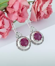 Sterling Silver Filigree Art Ruby Corundum Gemstone Floral Drop Earrings Earrings Length: 1.60 Inches; Width: 0.75 Inches Ruby Corundum is natural, opaque and dyed. It is 10 mm, faceted, round-cut. Oxidized and highly polished. Comes with a free silver polish cloth, velvet pouch and luxurious gift box. Filigree is made of delicate metal strands that have been skillfully fashioned to create an outstanding combination of old and modern art. Originating in Mesopotamia, Anatolia. It is made of delic Exquisite Dangle Earrings With Gemstone Accents, Elegant Sterling Silver Hoop Earrings As Gift For Her, Elegant Hoop Earrings As A Gift For Her, Exquisite Gemstone Drop Earrings, Exquisite Gemstone Dangle Earrings, Fine Jewelry Earrings With Gemstone Accents, Fine Jewelry Earrings With Gemstone Accents As Gift, Exquisite Round Earrings, Fine Jewelry Drop Earrings With Gemstone Accents