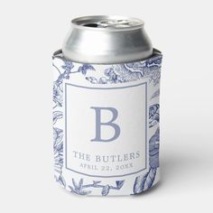 a blue and white floral can cooler with the letter b on it's side