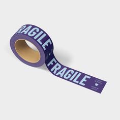 A roll of printed shipping tape with the words Fragile in fun purple colors. Tape Installation, Tape Dispensers, Design Tape, Fragile Tape, Blue Font, Tape Pattern, Business Packaging, Packaging Tape, Moving Boxes