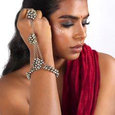 Jigyasa Hath Phool is a mesmerizing symbol of grace and allure. Crafted with utmost precision and adorned with cascading Ghungroo's and gleaming silver oxidized accents, it stands as a regal masterpiece that demands attention. As you slide this exquisite piece onto your hand, its delicate finger lets embrace you with comfort, while the sparkling gemstones and intricate petals add a touch of ethereal charm. Get one for yourself or gift it to your girl, Jigyasa is sure to adorn your attire. #Styli Knitted Jewelry, Symbol Of Grace, Hand Harness, Knit Jewelry, Hippie Bracelets, Quirky Fashion, Bracelet For Women, Favorite Jewelry, Hand Knitting