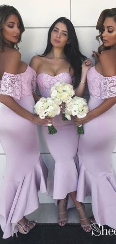 three beautiful women standing next to each other holding bouquets in their hands and posing for the camera