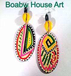 Hand painted with acrylic paints and glossed with a clear gloss for protection. Made out of a lightweight wood. Size 5in Hand Painted Yellow Artsy Earrings, Yellow Hand Painted Artsy Earrings, Artistic Hand Painted Yellow Earrings, Artsy Yellow Earrings With Artistic Design, Bohemian Hand Painted Earrings For Festivals, Yellow Artsy Earrings For Festivals, Handmade Artsy Jewelry For Festivals, Handmade Yellow Artsy Earrings, Handmade Artsy Yellow Earrings