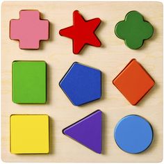 several shapes and sizes of wooden magnets on a table