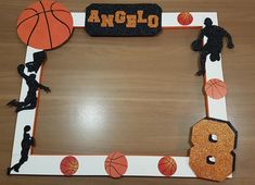 an orange and white photo frame with basketballs on the front, black and gold lettering that says angeloo