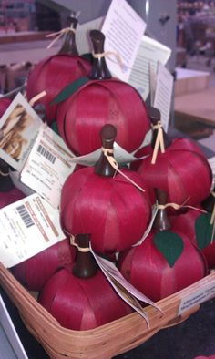 there are many red apples that have been cut into pieces and placed in a basket