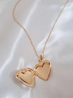 The most perfect heart locket and yes you can add a cute picture in there! Details Length: 18in Pendant: 29.4 x 19.3 mm Materials 18k gold filled Hypoallergenic Lead and nickel free Care For the best care of your product, remove before showering. Avoid excessive use of lotions and sanitizers, best to apply before adding your jewelry. Wipe down your jewelry with a soft, lint-free polishing cloth (we provide one) and stored in a safe dry place. Perfect Heart, Gold Heart Locket, Cute Picture, Heart Locket Necklace, Heart Locket, Gift Card Sale, Locket Necklace, Heart Of Gold, Chain Pendants