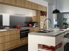 a modern kitchen with wooden cabinets and stainless steel appliances, along with an island in the middle