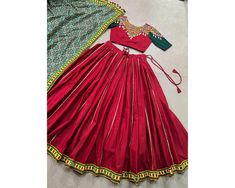 Red Chaniya Choli For Navratri PureCotton Lehenga Traditional Outfit garba Lehenga Full Stitched Gamthi Mirror work navratri lehenga Skirt Unveil Navratri Elegance with Pure Cotton Lehenga and Blouse, Featuring Tussar Silk Foiled Patola Print Dupatta Lehenga (Stitched) Lehenga Fabric : Pure Cotton Lehenga Work : Plain With Original Mirror Gamthi Work Lace Border And Gota Patti Touch Up Lehenga Waist : Support Up To 42  Lehenga Closer : Drawstring With Zip Stitching : Stitched With Canvas And Ful Red Chaniya Choli, Garba Lehenga, Chaniya Choli For Navratri, Lehenga Traditional, Choli For Navratri, Gamthi Work, Pink Lehenga Choli, Zip Stitching, Lehenga Stitched