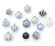 an assortment of blue and white christmas ornaments on a white background with space for text