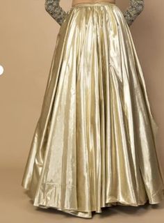 Glamorous Golden Metallic Skirt - Shimmering Elegance for Every Occasion Radiate sophistication and capture the spotlight with this stunning golden metallic skirt. Crafted to perfection, this skirt seamlessly blends contemporary style with a touch of vintage glamour. Description: Color: Luxurious Golden Metallic Material: High-quality Metallic Fabric Long Skirt in shimmer metallic fabric light soft smooth with crepe lining. Versatile Glam 🌟 Whether you're attending a glamorous evening event, a stylish cocktail party, or a special celebration, this skirt is the perfect choice. Pair it with your favorite heels and a sophisticated top to create an ensemble that's as unforgettable as you are. we offer colour customizations as per need and choice  for readymade sized please follow below chart Golden Lehenga, Long Skirt For Women, Golden Gown, Dress Book, Gold Skirt, Gown Skirt, Beige Skirt, Lehenga Skirt, Indian Lehenga