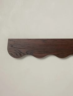 a piece of wood is hanging on the wall