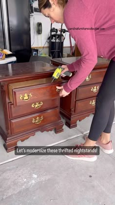 a woman in pink shirt sanding wooden furniture with a yellow duster on it