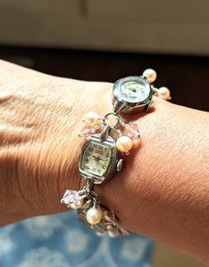 FUN! This is a bracelet made from vintage watches dating from the 1930s and up. There are a variety of watches used; this one includes Helbros 10k RGP, Cramers 17 jewel, Gruen Precision 17 jewel 10k RGP and Vail 10k RGP. I just love the different shapes of the watches! I've used pink faux pearls and pink crystals in this bracelet.  The bracelet measures about 1/2" wide and 7.25" long but can be shortened or lengthened to your specifications, simply send me a message. Each of my pieces are one of Antique Adjustable Jubilee Bracelet, Timeless Metal Bracelets For Wedding, Vintage Stainless Steel Jubilee Bracelet, Vintage Silver Stainless Steel Watches, Retro Adjustable Bracelets For Wedding, Vintage Formal Jewelry With Bracelet Strap, Vintage Stainless Steel Bracelet Jewelry, Vintage Stainless Steel Bracelet, Vintage Jubilee Bracelet