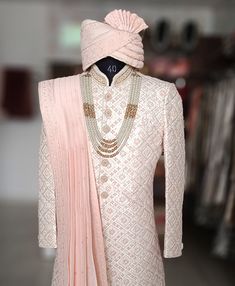 a white and pink outfit on display in a store