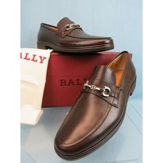 Bally "Cadore" Chocolate Calf Leather Silver Metal Bit "B" Logo Loafers By Bally 100% Authentic, Guaranteed!!! Color: Chocolate (Printed On The Box) Leather Upper Silver Tone Metal Bit " B" Logoon The Vamp Round Toe Leather Lining "Bally" Letterin Stamped Logo At Both Sides Rubber "Bally" Stamped Logo Sole "Bally" Stamped Logoleather Insole 3/4" Block Heel Men's Size Eu 9.5 E / Us 10.5 D / Fr 43.5-Print On The Box Original Price: $ 595 Note!!! These Shoes Came From A Famous Store !!! They Are Ne Designer Brown Formal Moccasins, Bally Shoes, B Logo, Slip On Dress Shoes, Chocolate Leather, Brown Leather Loafers, Color Chocolate, Suede Tassel, Tassel Loafers