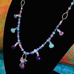 An Absolutely Gorgeous Artisan Gemstone Necklace, Handmade With A Delicate Rainbow Of Soft Blues, Purples & Pinks That Shimmer In The Light & Add Exquisite Beauty To Your Dresses & Tops. With Genuine Amethyst, Blue Chalcedony, Jade, Swarovski Crystals, Cubic Zirconia & Sterling Silver Chain & Components. Closure Is By Adjustable Chain Clasp At The Back. The Necklace Measures Approx. 17”-18” Long. Brand New. Nwt Purple Multi-stone Gemstones For Gift, Purple Crystal Necklaces With Gemstone Accents For Jewelry Making, Purple Multi-stone Dangle Jewelry, Purple Crystal Necklaces With Gemstone Accents, Purple Multi-stone Dangle Earrings, Purple Teardrop Multi-stone Jewelry, Purple Crystal Necklace For Jewelry Making, Purple Crystal Necklaces With Gemstone Accents For Gift, Purple Crystal Necklaces With Stones For Jewelry Making