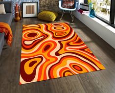 an orange and red rug in a living room