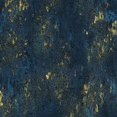 an old blue and gold wallpaper with paint splattered on it's surface