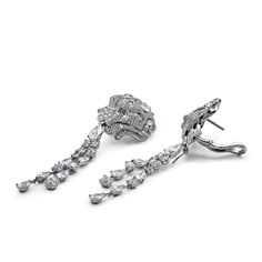 Chanel Lion Royal Earrings, Medium Version, White Gold, Diamonds Details 18k White Gold 1 Pear Cut Diamond .75cts (E-VVS2) 1 Pear Cut Diamond .75cts (F-IF) 28 Fancy Cut Diamonds 6.77cts (F+ - VVS+) 472 Round-Cut Diamonds 4.03cts (F-G - VVS1/2) *Comes with original box and certificate. *These Chanel earrings are unique. UK retail £175,000 with vat. UK retail £145,000 without vat.Product Number: J60875 Luxury Diamond White Platinum Cluster Earrings, Luxury Platinum Cluster Earrings In Diamond White, Luxury Diamond Cluster Earrings For Formal Occasions, Luxury Diamond Earrings With Pave Setting For Evening, Luxury Platinum Dangle Diamond Earrings, Luxury Hand Set Round Diamond Earrings, Luxury Hand-set Earrings For Evening, Luxury Hand Set Earrings For Evening, Luxury Platinum Bridal Earrings With Diamond Accents