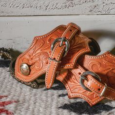 Martin Saddlery Oak Leaf Spur Straps 7-1/2in SSLAO The Oak Leaf spur strap on natural skirting leather features acorn oak tooling and a stainless steel buckle. Oak Leaf Spur Strap, Acorn Oak tooled with stainless steel buckle. Brown Hand Tooled Adjustable Belts And Suspenders, Adjustable Leather Western Belts And Suspenders, Adjustable Western Brown Belts And Suspenders, Adjustable Brown Western Belts And Suspenders, Adjustable Brown Western Belt, Hand Tooled Leather Belt Buckles For Ranch, Adjustable Artisan Leather Belt Buckles, Western Style Belts And Suspenders With Concho, Western Style Adjustable Belts And Suspenders With Concho