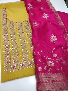 Item Overview ATHARVA Hand Embroidery Salwar Kameez/Embroidery Neck Yellow/Banarsi Silk Dupatta/Custom Stitch/Tunic/Patiala/Churridar/Anarkali Dno. CH1690 Fabric: * Shirt - Chanderi Silk- Hand Embroidered Neck - Yellow- 2.5 Mts - Beautiful Hand Embroidery * Dupatta: Banarasi silk Dupatta- All over Embroidery - 2.5 Mts- Latkans Tassels - Dark Pink * Bottom Santoon Silk 2.5 Mts. Excusive Hand Embroidered Party Wear Punjabi Suit. Customization: * Fabrics Customization: Designs Can be made in differ Transitional Yellow Churidar With Zari Work, Chanderi Churidar With Gota Work For Transitional Season, Anarkali Churidar With Zari Work For Festivals, Pink Chanderi Churidar For Transitional Season, Yellow Raw Silk Churidar With Gota Work, Transitional Pink Salwar Kameez With Gota Work, Pink Chanderi Kurta With Pallu Detail, Anarkali Churidar In Jamawar For Navratri, Unstitched Kundan Anarkali Set With Pallu