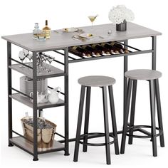 a kitchen table with two stools and a wine rack on the bottom shelf next to it