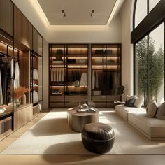 a large walk in closet filled with lots of clothes and furniture next to a window