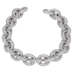 18 kt. white gold chain bracelet with full pave round-cut diamonds. The clasp is embedded with black diamonds to make it easier to open. Round cut diamonds: 30.76 carat ( H-I color / VVS1-VVS2 ) Round-cut black diamonds: 0.25 carat White gold: 61.00 gr. This classic bracelet is Hand-Made in Italy. The bracelet can be customized. Gold Chain Bracelet, White Gold Chain, Classic Bracelets, White Gold Chains, Diamond Chain, Black Diamonds, Gold Bracelet Chain, Round Cut Diamond, Pave Diamonds