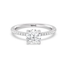 a white gold engagement ring with diamonds on it