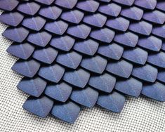 These Dragon Scales are directly printed onto black netting fabric, that can be sewn or glued onto other fabrics and materials.  Each fabric rectangle is 7" x 9" and scale section is 5.5" x 6.5".  Scale swatches can be easily combined to make larger pieces for your next cosplay or LARP event! All scales are printed using metallic PLA filament.  Please allow 1-3 days to process, depending on quantity ordered.   All orders are shipped via USPS.  Shipping upgrades are available in the dropdown menu Metallic Dragon, Netting Fabric, Medieval Cosplay, Dragon Armor, Dragon Scales, Cosplay Armor, Dragon Scale, Adult Costumes, Larp