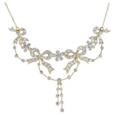 A breathtaking ribbon and floral of bright white diamonds, together weighing approx. 2.50 carats, form the ultra-sparkling centerpiece of this strikingly stunning showstopper crafted in yellow gold. Most likely dating back to the 20th century, the open feminine design clearly evokes Edwardian era splendor and refinement. A fabulous and impressive vintage necklace suitable for the fanciest of affairs. Necklace Information Style: Edwardian Metal: 18K Yellow Gold Width: 77 mm. Length: 65 mm. (length excludes chain) Weight: 17.50 g. (approx. in total) Gemstone Type: Diamond Shape: Round Average Color: H Average Clarity: SI Size: 1.8 - 2.5 mm. Number: 93 Weight: 2.50 Carat (approx. in total) This necklace will be made to your order in 1-2 weeks, contact us to find out more. An attractive jewelr Luxury Vintage Yellow Gold Diamond Necklace, Luxury Vintage Brilliant Cut Diamond Necklace, Luxury Exquisite Yellow Necklace, Fine Jewelry Yellow Gold Flower-shaped Diamond Necklace, Dior Necklace Vintage Gold, Edwardian Jewelry, Big Diamond, Van Cleef Arpels, Floral Necklace