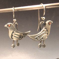 Whimsical bird earrings in mixed metals of copper and argentium sterling silver are unique and fun earrings with a bit of bohemian spirit for those that love handcrafted art jewelry that speaks to the soul.  We have oxidized and polished them to highlight and provide contrast, depth and interest between the metals and to the detailing of the riveted copper eye, sleek wing and the stamped feet. A great gift for a bird or nature lover or enthusiast along with those interested in Ornithology.  Hand Artsy Hand Forged Earrings For Gift, Copper Eye, Jewelry Bird, Metalsmith Jewelry, Silver Bird, Bird Earrings, Handcrafted Art, Fun Earrings, Mixed Metals