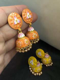 Very stylish and vibrant colors meena work jhumka earrings. Stunningly made designs with all the love and hand painted meena kari, perfect match for a perfect outfit! Grab all the lovely new arrivals we have! Colors : yellow, orange In stock and ready to wear. Bollywood Latkan Earrings As Gift, Bollywood Style Latkan Earrings For Gift, Bollywood Style Latkans Earrings For Gift, Bollywood Style Latkans Earrings As Gift, Handmade Kundan Earrings As Gift, Handmade Bollywood Drop Bridal Earrings, Handmade Multicolor Jhumkas For Festive Season, Yellow Round Meenakari Jewelry, Handmade Jhumkas For Festivals