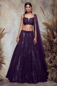 Purple lehenga with all-over sequin embroidery. Comes with blouse and net dupatta.
Components:3
Pattern:Embroidery
Type of Work:Sequin
Neckline:Notch
Sleeve Length:Sleeveless
Fabric:Net
Color:Purple
Other Details:
Blouse with bead drops
Shoulder straps
Blouse with sequin embroidery border
Closure: Side zip
Occasion:Bride - Aza Fashions Shimmer Lehenga, Lengha Blouse Designs, Sequence Lehenga, Sequin Lehenga, Purple Lehenga, Sangeet Outfit, Raw Silk Lehenga, Lehenga Designs Simple, B Tech