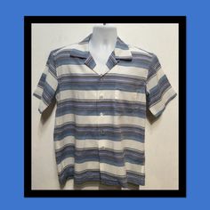 "1950s vintage reproduction Hollywood Rogue cotton blend zig zag stripe \"Rock N Roll\" shirt.  The shirt has a loop collar, five button down front, one patch pocket and short sleeves. The cotton blend fabric is a tri-tone horizontal stripe in black, blues and white with an added zig zag stripe design. The label reads \"Hollywood Rogue\" and the shirt is in new unworn condition. As with some clothes made by \"Hollywood Rogue\" this shirt was made with original 1950's style fabric and is only ava 1950s Fashion, Cuff Sleeves, 1950s Vintage, Stripes Design, Rock And Roll, Cotton Blend, Short Sleeves, Tee Shirts, Blue And White