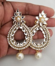 MK Fashionkart - Handmade Jewelry Indian Fashion Jewelry Partywear white Stone Earrings with pearl hanging Suitable for Saree/Salwar/party wear dresses Free Shipping SHIPPING : Ready to ship in 1 business day. This item will be shipped from The United States. Jewelry care instructions : 1. Please wipe the jewelry with a piece of cotton cloth after usage. 2. Store the jewelry in a cool, dry and air tight box or pouch. 3. Make sure the jewelry is away from direct heat and water. 4. Please wipe of White Bridal Earrings For Diwali Party, White Chandbalis Drop Earrings For Festive Occasions, White Chandbali Earrings With Stone Work, Festive White Chandbalis Drop Earrings, White Kundan Earrings With Latkans, White Chandbalis Drop Earrings For Diwali, White Chandbali Earrings For Celebration, White Kundan Bridal Earrings For Festive Occasions, White Latkan Earrings For Festive Occasions