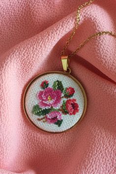 Rose flower necklace is a wonderful gift for romantic women. A hand embroidered pendant necklace is a great gift for daughter, mom or wife. Cross stitch jewelry perfect for every day and for a special occasion. Pink Embroidered Jewelry As A Gift, Pink Round Necklace For Mom, Handmade Pink Necklace For Mom, Handmade Rose Jewelry For Gifts, Handmade Rose Gold Necklace For Mom, Handmade Rose Gold Necklaces For Mother's Day, Handmade Rose Gold Necklace Gift For Mom, Vintage Jewelry With Floral Embroidery For Gift, Handmade Rose Flower Jewelry