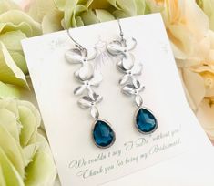 #giftforher #giftunder30 #readytoshipgift #personalizedgift #lalacrystal #bridesmaidgifts #flowergirl #jewelry #necklace #orchidnecklace #weddingnecklace #bridalgift #christmasgift #gift for her Teardrop Flower Charm Jewelry For Wedding, Dangle Flower Earrings For Wedding On Mother's Day, Teardrop Wedding Jewelry With Flower Charm, Flower Charm Earrings For Wedding On Mother's Day, Flower Charm Earrings For Wedding And Mother's Day, Silver Bridal Earrings With Flower Charm As Gift, Mother's Day Wedding Flower Charm Earrings, Blue Dangle Flower Earrings For Wedding, Nickel-free Blue Flower Earrings For Wedding