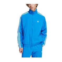 This Is A Brand New With Tags, Unworn Adidas Men's Bluebird Blue Woven Fbird Tt Track Jacket In Size 2xl. It Is Made Of 100% Polyester And Features A Full Zip Front, Two Side Pockets, And A Ribbed Collar And Cuffs. The Jacket Is Also Water-Resistant And Windproof, Making It Perfect For Outdoor Activities. F23 Blue Spring Sports Outerwear, Blue Track Jacket For Sports In Spring, Blue Track Jacket For Spring Sports, Spring Blue Track Jacket For Sports, Adidas Blue Track Jacket For Streetwear, Casual Blue Adidas Outerwear, Blue Cotton Track Jacket For Fall, Casual Blue Track Jacket For Fall, Blue Cotton Long Sleeve Track Jacket