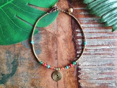 This is our crystal gemstine spiral queen anklet, which features a golden brass spiral at the centre, bordered by orange agate, turquoise, red howlite and jade gemstones. The crystal anklet is embellished with golden brass beads and curved brass tube bars! Perfect to embody your bohochic style, from beachwear to daywear all year round! The anklet is held together with dark brown macramé waxed cotton and fastens with a strong bell and loop at two lengths: 24cm 26cm Please do measure your ankle to Bohemian Nickel-free Anklets For Festivals, Adjustable Nickel-free Bohemian Anklets, Adjustable Nickel-free Anklets For Festival, Festival Brass Jewelry With Tiny Beads, Bohemian Gold Beaded Nickel-free Bracelets, Bohemian Gold Beads Anklets For Summer, Bohemian Gold Anklets As A Gift, Adjustable Bohemian Anklets As Gift, Adjustable Bohemian Anklets For Gifts