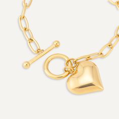 Steal all the attention at your next event with this trendy heart charm T-bar bracelet. This beautiful piece would make a great fashion accessory to any event - work or play.Featuring a modern T-bar clasp for ease of wear. Gold-Tone Plated | Nickel, Lead, and Cadmium Free Product Code: DB2149K Collection: Sweetheart Type: Clasp Material: Stainless Steel Dimensions: Length 18-21cm Pendant Dimensions: Style: Heart & Chain-Link Includes: Bar Bracelet, Great Fashion, Heart Chain, Free Product, Bar Bracelets, Soft Towels, Perfume Spray, Keep Jewelry, Everyday Jewelry