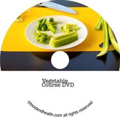 a white plate topped with celery on top of a yellow and black table