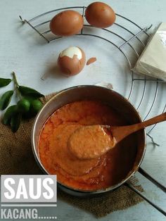 an image of eggs and sauce in a pot