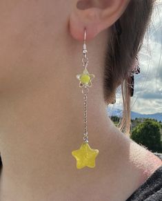 Fun bright addition to your jewelry collection. These shootings star earrings feature 2 stars connected by a chain. They are perfect for any occasion! These earrings are made with 925 silver plated copper, and are hypoallergenic. Handmade Yellow Star-shaped Jewelry, Handmade Yellow Star Jewelry, Star Charm Earrings For Jewelry Making, Nickel-free Star-shaped Earrings For Jewelry Making, Fun Jewelry Aesthetic, Lesbian Earrings, Crazy Earrings, Lantern Earrings, Star Earring